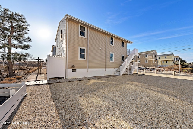 5909 Ocean Blvd, Long Beach Twp, NJ 08008 - rear view of property with stairs and a wooden deck