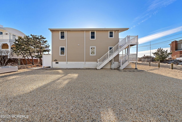 5909 Ocean Blvd, Long Beach Twp, NJ 08008 - rear view of house featuring stairway and fence