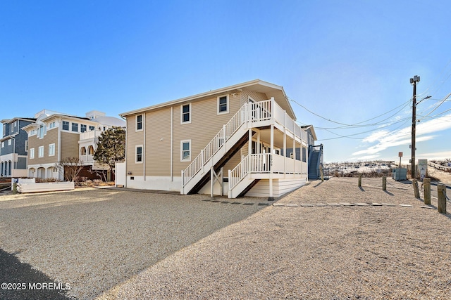 5909 Ocean Blvd, Long Beach Twp, NJ 08008 - rear view of house featuring stairs