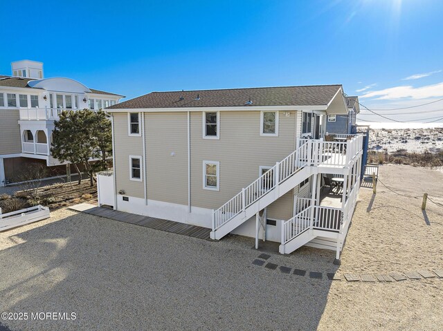 5909 Ocean Blvd, Long Beach Twp, NJ 08008 - rear view of house with a wooden deck and stairs