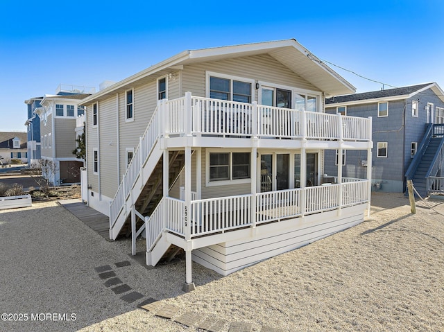 5909 Ocean Blvd, Long Beach Twp, NJ 08008 - rear view of house featuring stairs