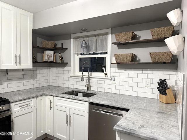 kitchen with dishwasher, open shelves, a sink, and white cabinets