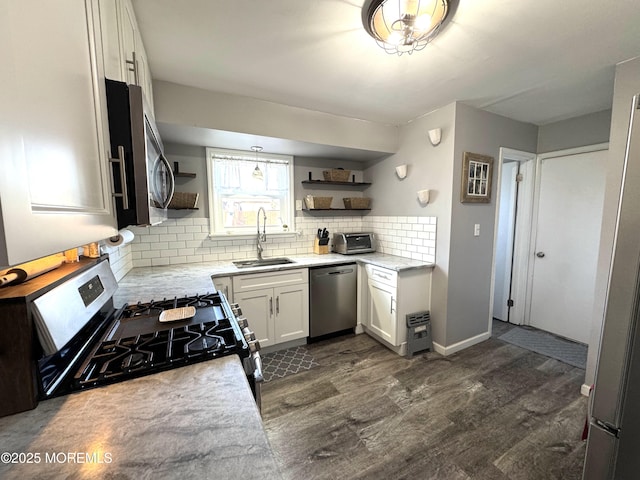 kitchen with dark wood-style floors, open shelves, stainless steel appliances, backsplash, and a sink