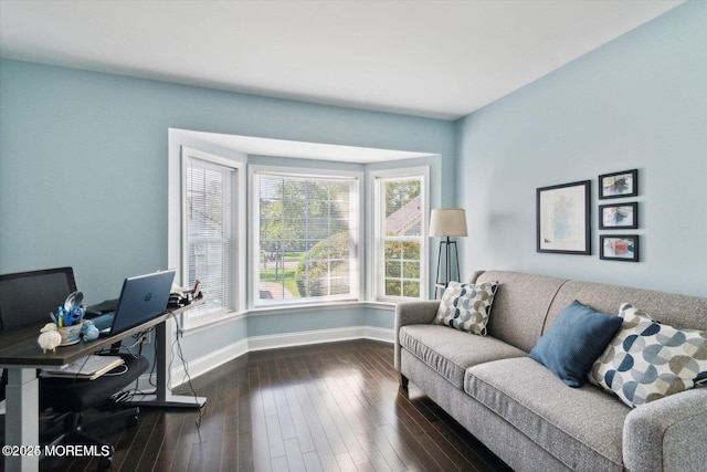 office space with dark wood-type flooring and baseboards