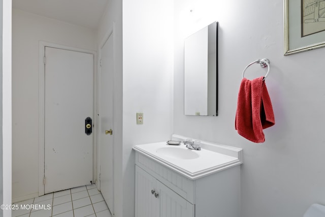 bathroom with tile patterned flooring and vanity