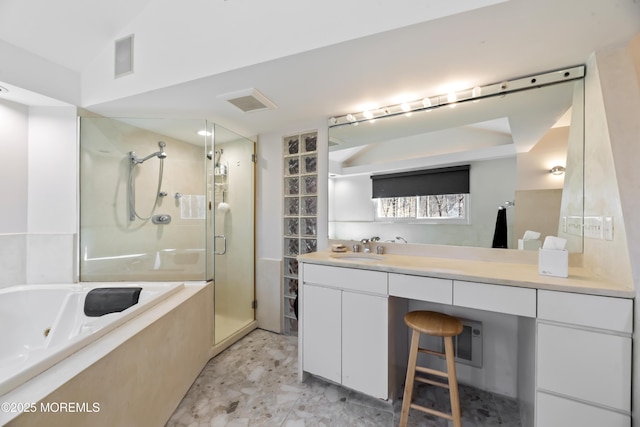 bathroom with a whirlpool tub, a stall shower, visible vents, and vanity