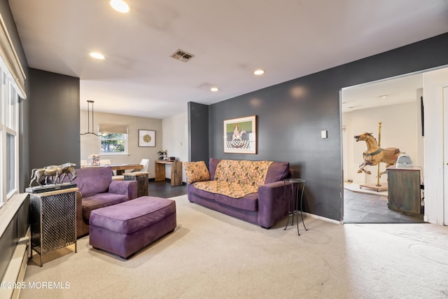 carpeted living area featuring recessed lighting, baseboards, visible vents, and baseboard heating