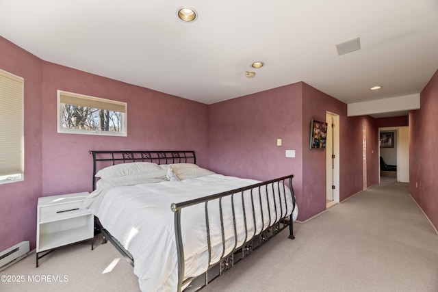 bedroom with carpet floors, a baseboard radiator, and recessed lighting