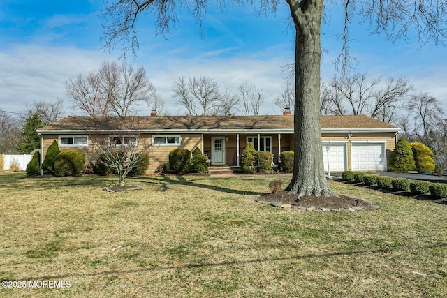 single story home with a front lawn, an attached garage, fence, and a chimney