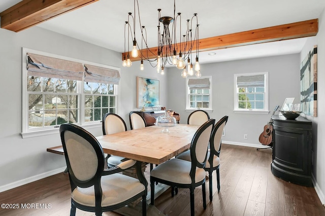 dining area featuring beamed ceiling, an inviting chandelier, baseboards, and dark wood-style flooring