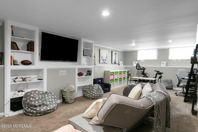 living room featuring carpet flooring, recessed lighting, baseboards, and built in shelves