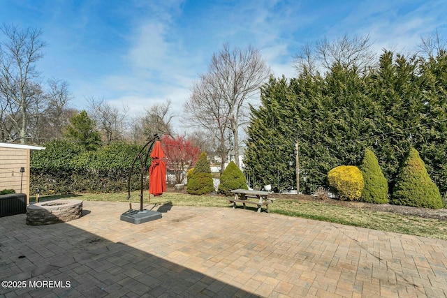 view of patio / terrace with an outdoor fire pit