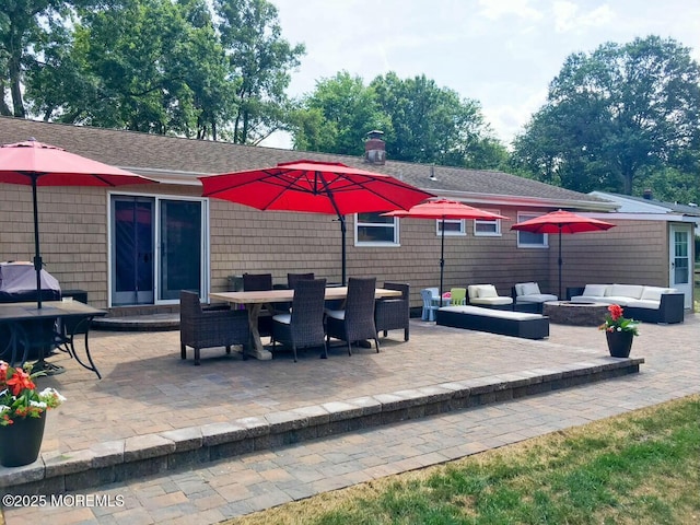 view of patio / terrace featuring outdoor dining space, an outdoor hangout area, and entry steps