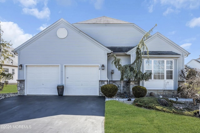 view of front facade with a garage, a shingled roof, stone siding, aphalt driveway, and a front yard