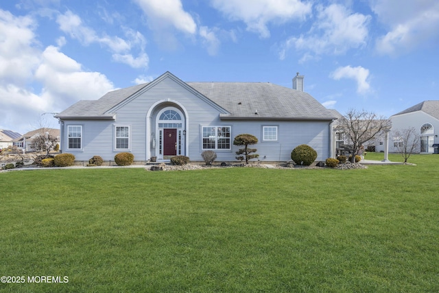 single story home with a chimney and a front yard