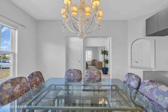 dining area with a notable chandelier