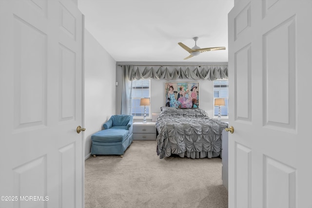 carpeted bedroom featuring ceiling fan