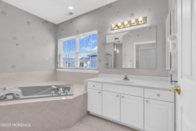 full bath featuring visible vents, vanity, and a bath