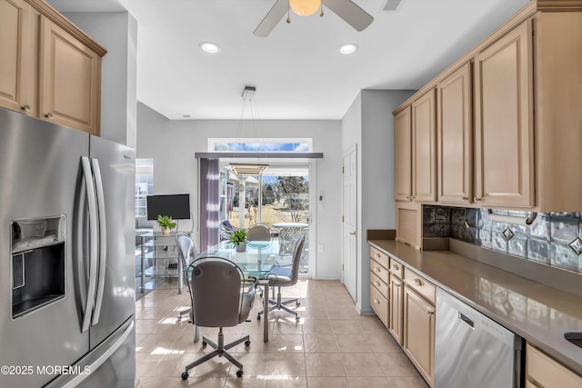 kitchen featuring light tile patterned floors, stainless steel appliances, recessed lighting, tasteful backsplash, and light brown cabinets