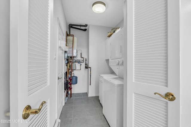 laundry area featuring light tile patterned floors, gas water heater, a baseboard radiator, laundry area, and stacked washer / dryer