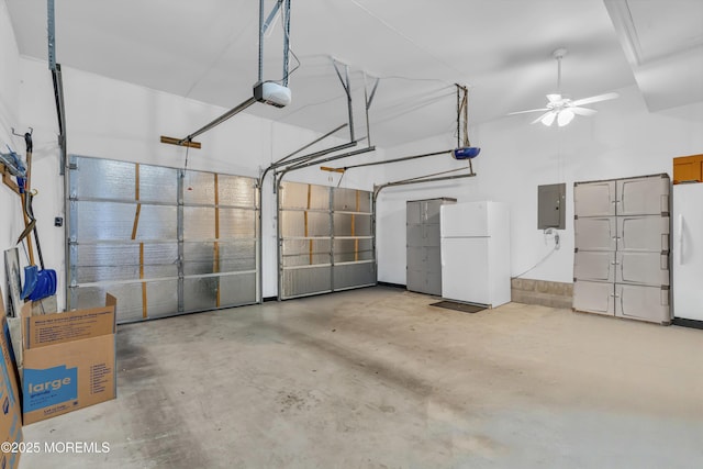 garage featuring a garage door opener, freestanding refrigerator, and electric panel