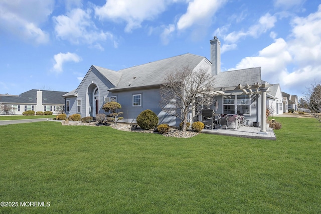 exterior space with a chimney, a front yard, a patio area, and a pergola