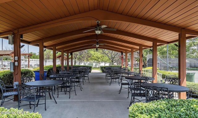 view of patio / terrace featuring a ceiling fan, outdoor dining area, and fence