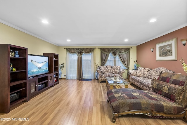 living area with recessed lighting, wood finished floors, and crown molding