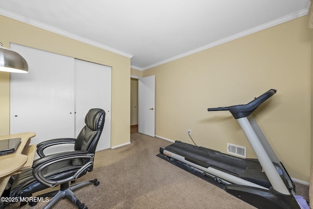 office area with carpet floors, baseboards, visible vents, and crown molding