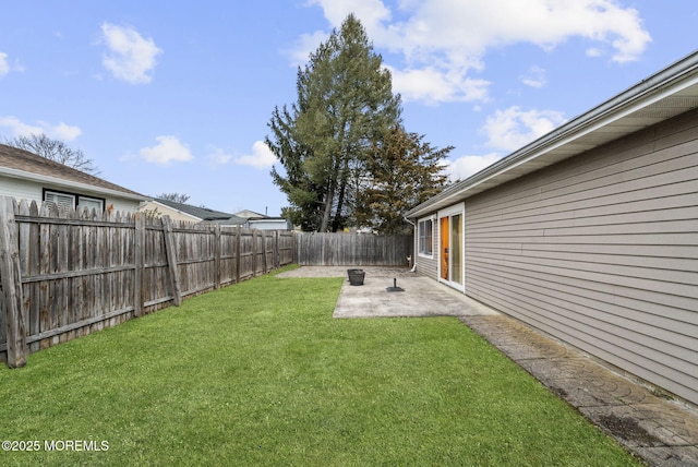 view of yard with a fenced backyard and a patio