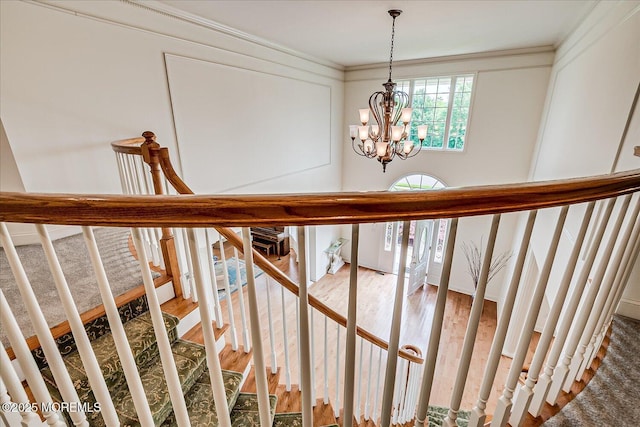 1 Christie Ln, Freehold, NJ 07728 - stairs with a chandelier, crown molding, and wood finished floors