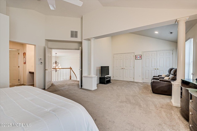 1 Christie Ln, Freehold, NJ 07728 - carpeted bedroom with multiple closets, high vaulted ceiling, decorative columns, and a chandelier