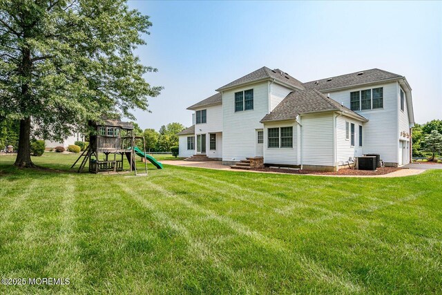 1 Christie Ln, Freehold, NJ 07728 - rear view of house with a yard, a playground, roof with shingles, and entry steps