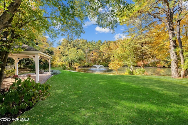 view of yard with a water view and a gazebo