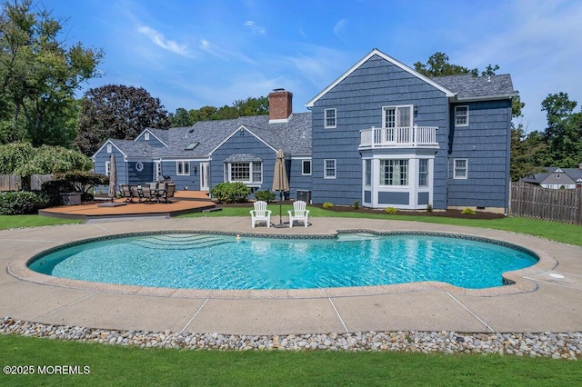 view of pool with a fenced in pool, a patio, and fence