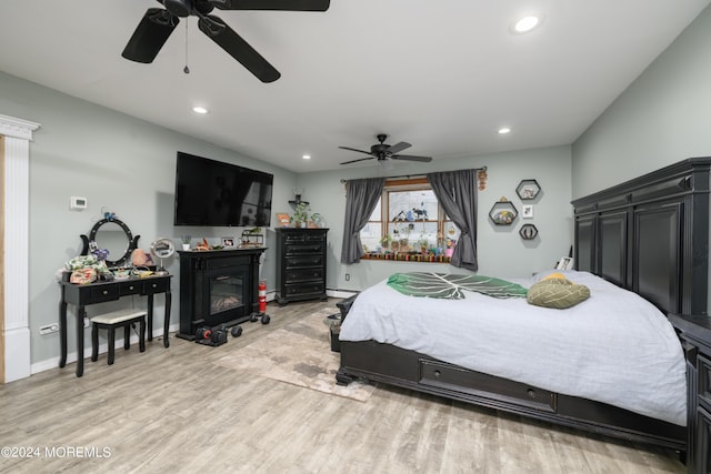 bedroom featuring light wood-style floors, baseboards, a ceiling fan, and recessed lighting