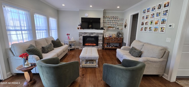 living area featuring baseboards, dark wood-style floors, ornamental molding, a fireplace, and recessed lighting