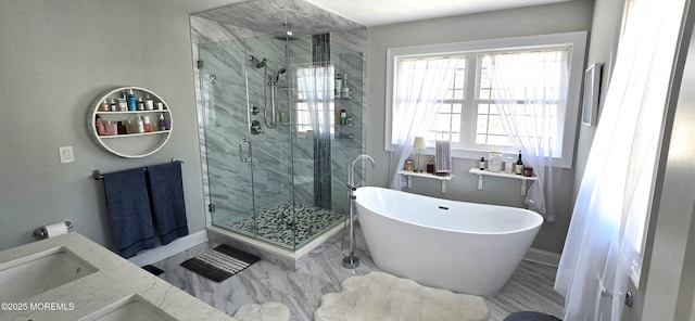 full bathroom featuring a soaking tub, a shower stall, baseboards, and marble finish floor