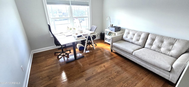 office with baseboards and dark wood-style flooring