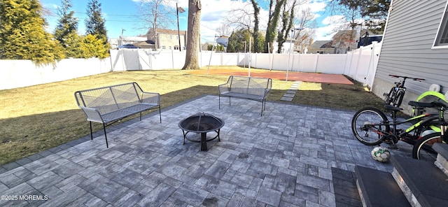 view of patio with a fire pit and a fenced backyard