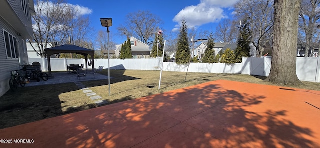 view of patio with a fenced backyard and a gazebo