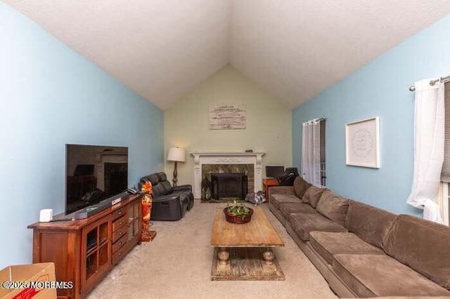 living area with light carpet, lofted ceiling, and a high end fireplace