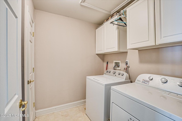 washroom with cabinet space, separate washer and dryer, baseboards, light floors, and attic access