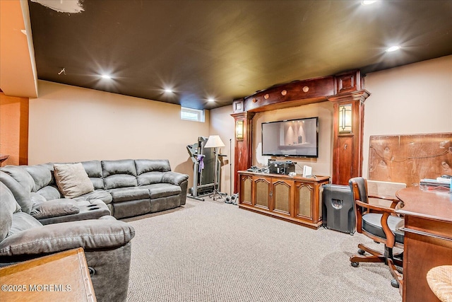 carpeted living area with recessed lighting