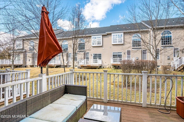 exterior space with a residential view and a deck