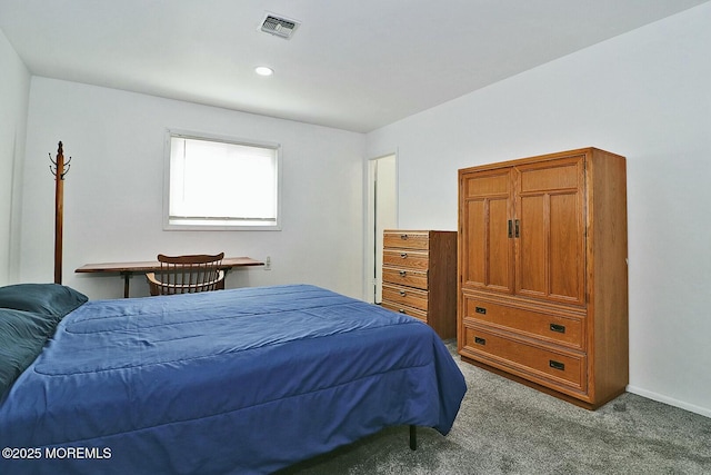 carpeted bedroom with visible vents and baseboards