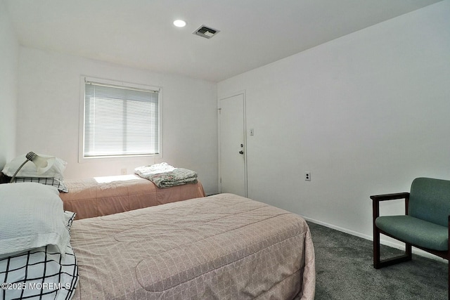 bedroom with recessed lighting, visible vents, dark carpet, and baseboards