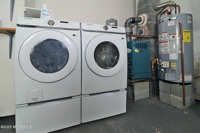 laundry area featuring gas water heater, independent washer and dryer, and laundry area