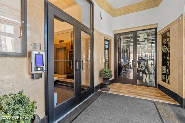 entrance to property featuring stucco siding and french doors