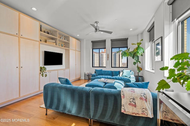 living area featuring a wealth of natural light, recessed lighting, a ceiling fan, and light wood finished floors